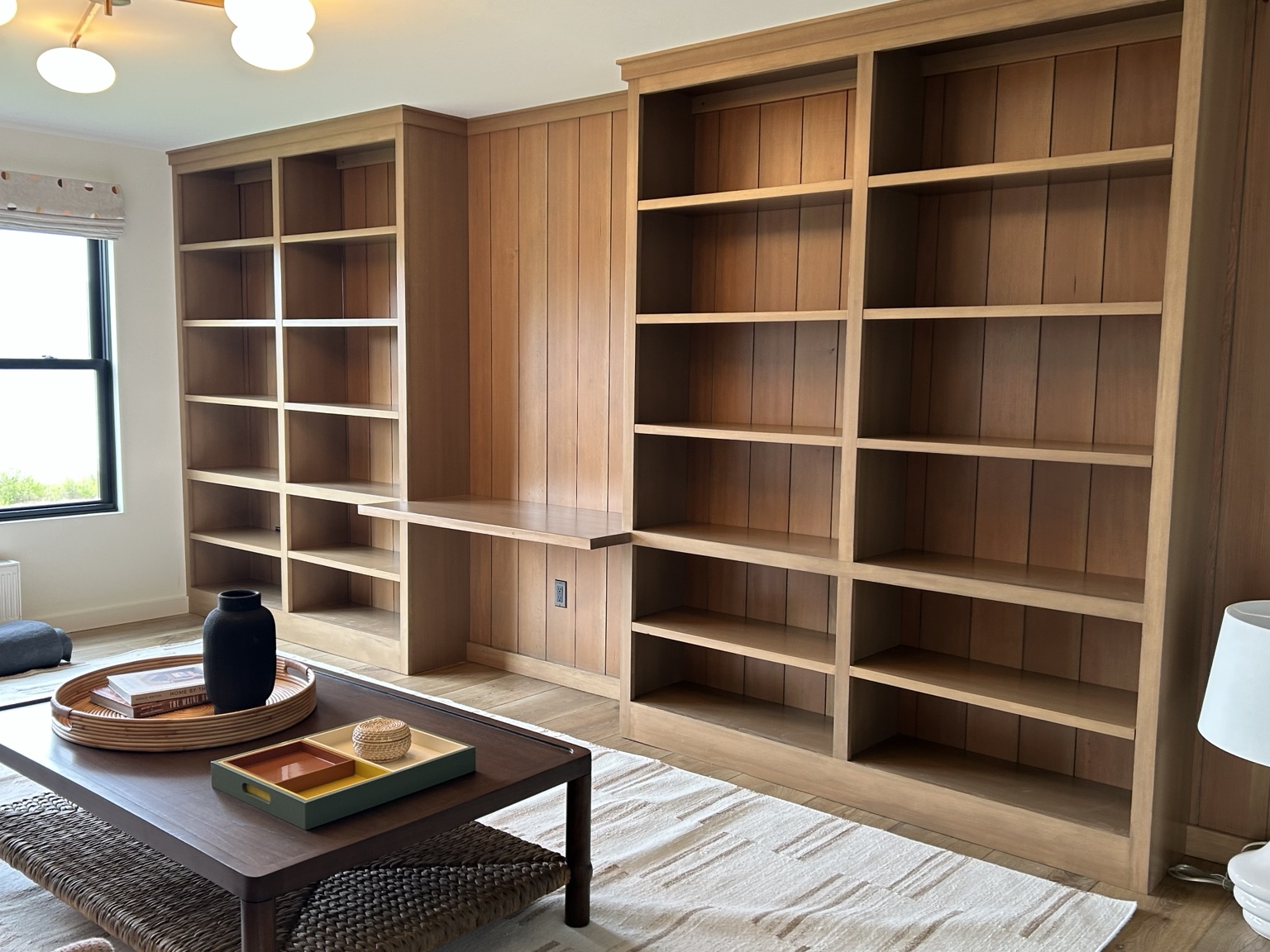 Natural wood bookcase wall